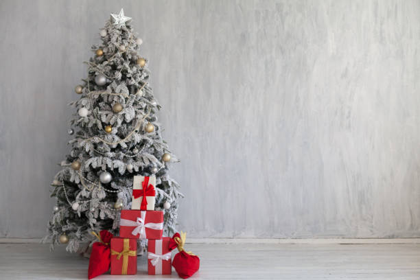 istock Christmas tree with decoration and gifts new year 1069227654