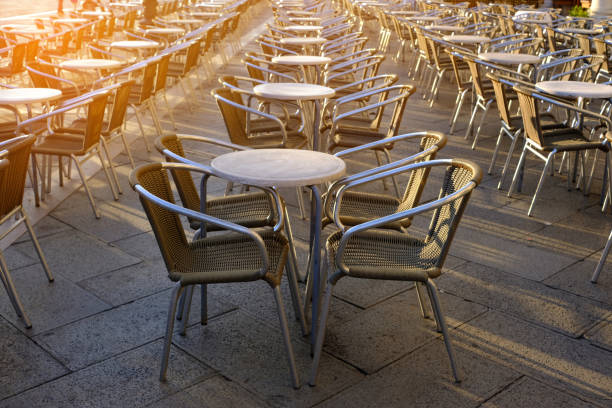 istock Old european city street cafe table 1069228640