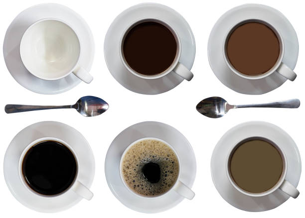 istock cups ,filled coffee or tea ,spoon,plates,black ,latte,bubbles,malt ,top view on iaolated white background 1069229394