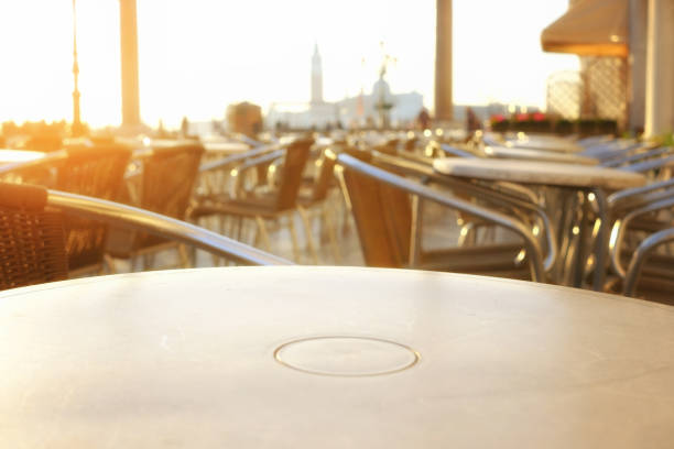istock Old european city street cafe table 1069229400