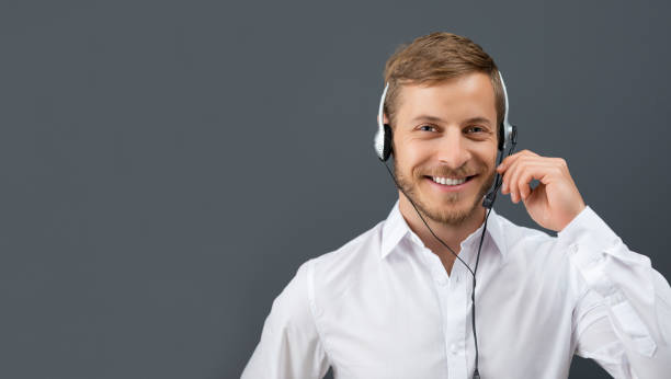 istock Call center employee isolated on a gray background. 1069230852