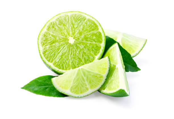 istock Limes with slices and leaves isolated 1069231034