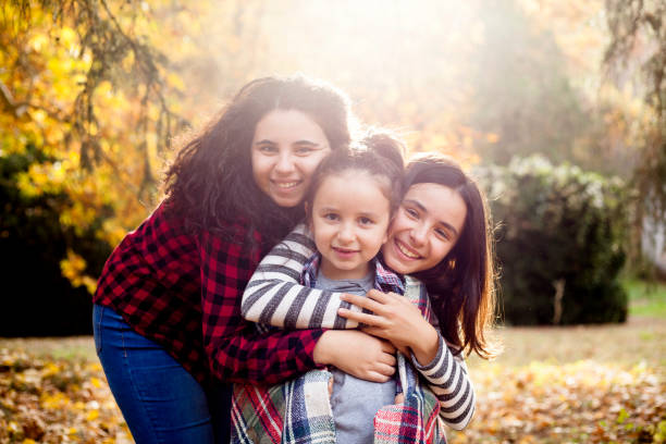 istock portrait of three beautiful sisters 1069232478