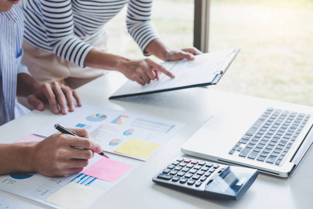 istock Business team collaboration discussing working analysis with financial data and marketing growth report graph in team, Meeting Talking Brainstorming Communication Concept 1069232796