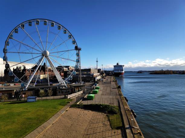 istock Ferris wheel of Helsinki with ship and islands 1069233070