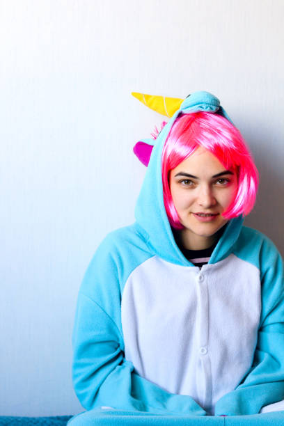 istock woman in unicorn costume 1069234688