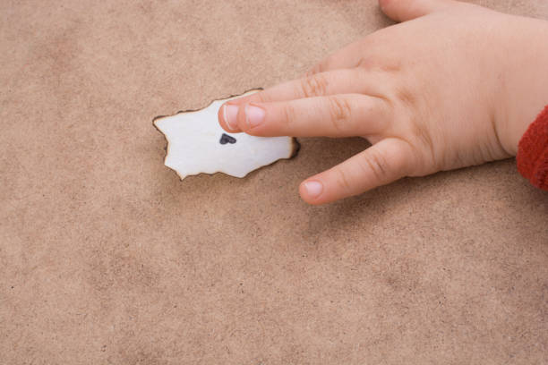 istock Piece of burnt paper  on brown background 1069235380