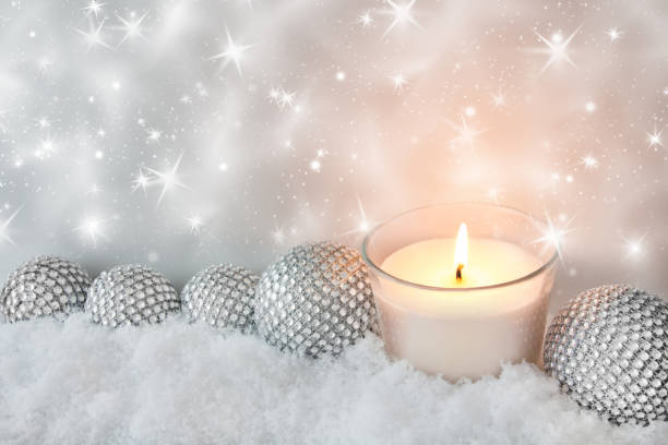 istock White silver Christmas decoration with candle and snow 1069239524