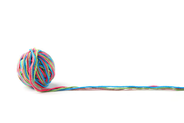 istock Colorful cotton thread ball and thread line from four color thread isolated on white background. 1069251822
