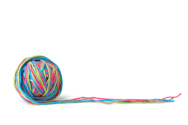 istock Colorful cotton thread ball and thread line from four color thread isolated on white background. 1069251842