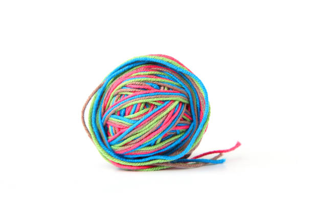 istock Colorful cotton thread ball from four color thread isolated on white background. 1069251866