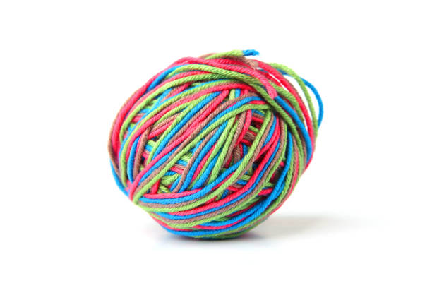 istock Colorful cotton thread ball from four color thread isolated on white background. 1069251936