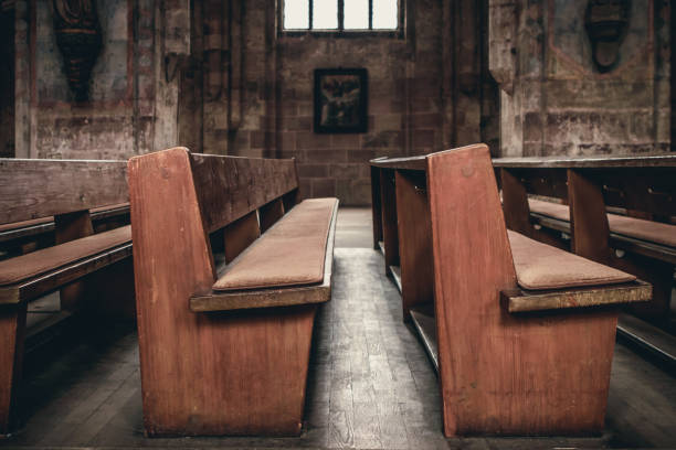 istock Church interior, wooden bench and stone wall in the background 1069254508