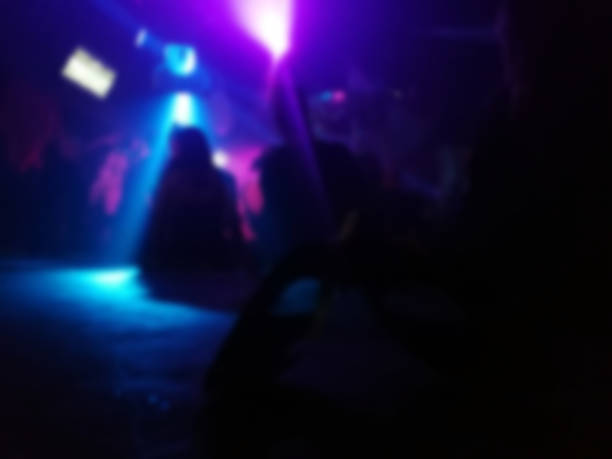 istock Blurred, abstract masquerade in the club 1069260504