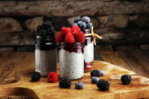 istock Healthy breakfast. chia pudding with kiwi and granola in glass on rustic background. 1069261590