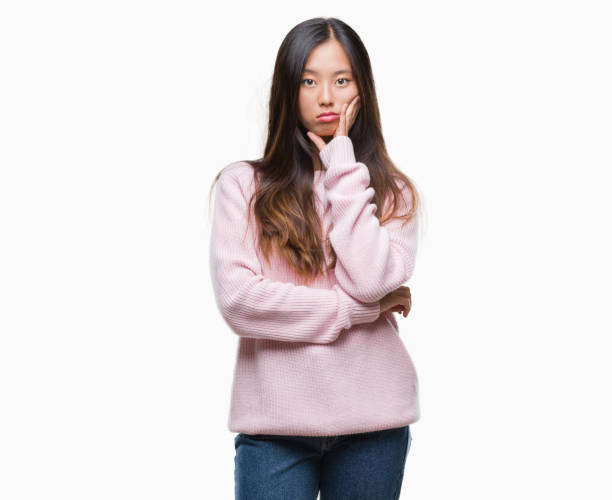 istock Young asian woman over isolated background thinking looking tired and bored with depression problems with crossed arms. 1069264462