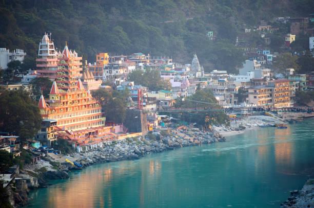 Spectacular view of the Lakshman Temple bathed by the sacred river Ganges at sunset. stock photo