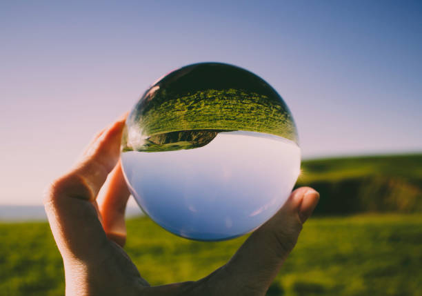 Crystal photography ball showing the beauty of St Bees Head Crystal photography ball showing the seascape at St Bees, Whitehaven, Cumbria - British seaside process plate stock pictures, royalty-free photos & images