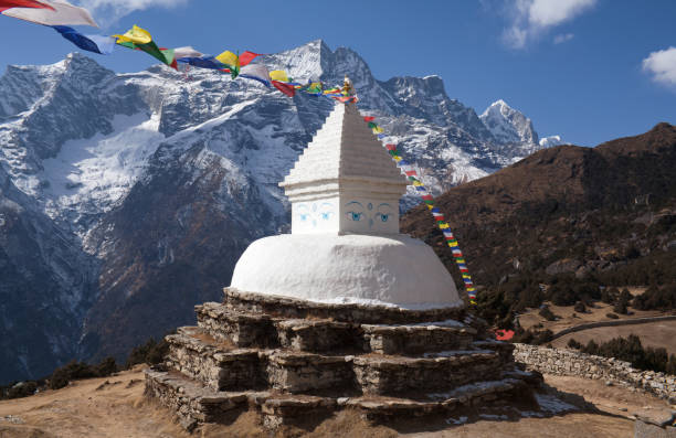 istock Buddhist white stupa above Namche Bazaar in Nepal Himalayas 1069281526