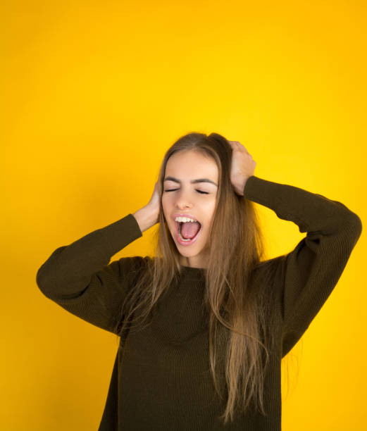 istock Happy screaming pretty woman in sweater 1069286372