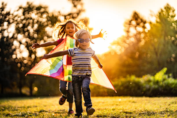 istock Girl running for a little boy pilot 1069286532
