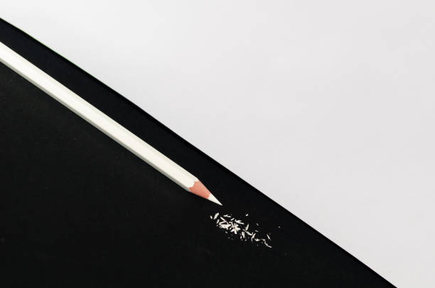 istock White Pencil With Shaving Isolated on black background. 1069286880