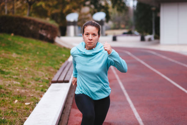 istock Woman running. Female runner jogging 1069287102