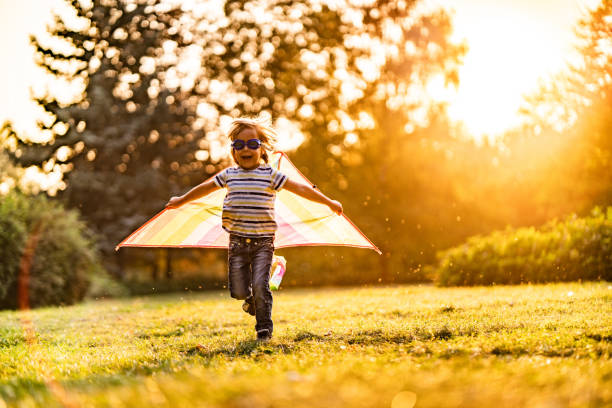 little cute pilot at sunset - smiling little girls little boys autumn imagens e fotografias de stock