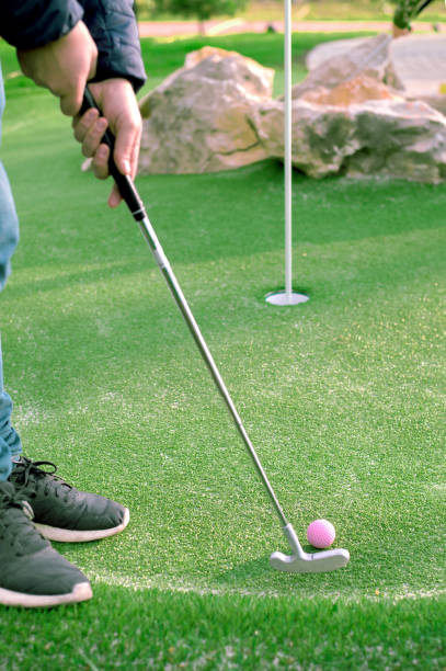 istock Golf ball and Golf Club on Artificial Grass. 1069287390