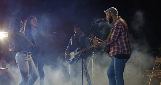 istock People dancing to a live band on an cold urban rooftop 1069290960