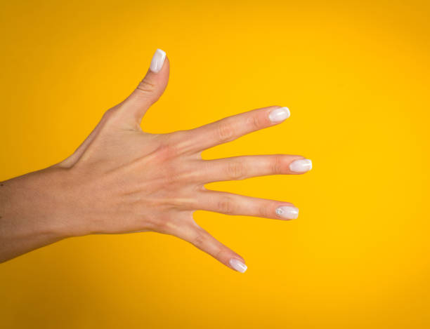 istock Woman hands over yellow background 1069291670