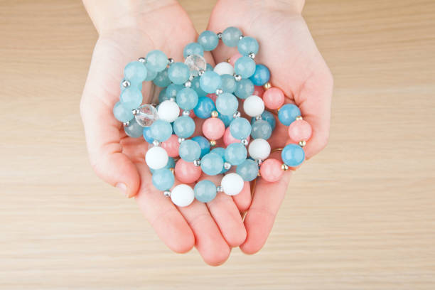 istock silver blue agate ceramic bracelet stones woman hands 1069298324