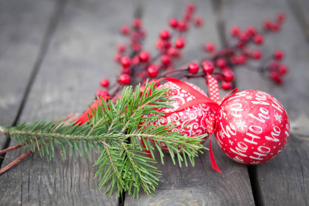 istock Red Christmas ball decoration on rustic wood background 1069298436