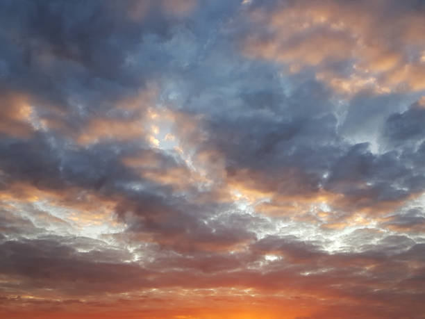 istock Fiery orange sunset colorful and speckled  clouds. Beautiful sky. 1069298864