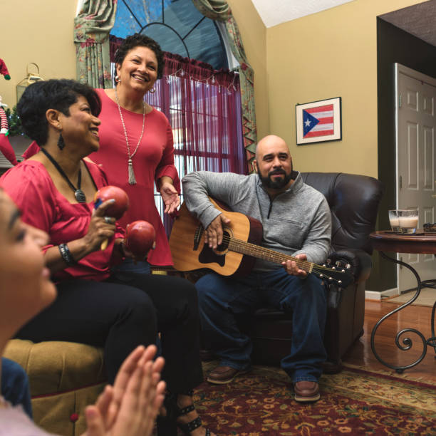 Family and friends celebrating with music Multi-generation family and neighbors gather for a parranda. traditional song stock pictures, royalty-free photos & images