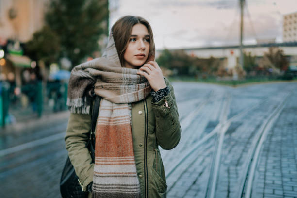 istock beautiful woman posing in winter 1069307382