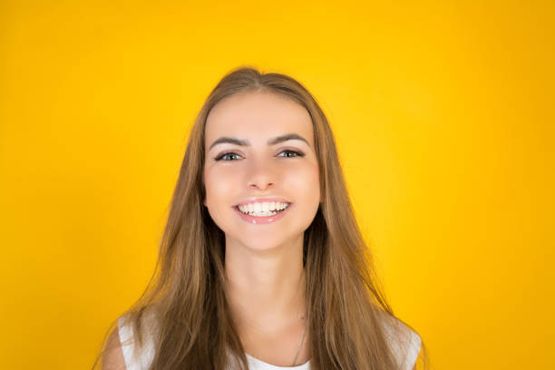 istock Happy cheerful young woman looking at camera with joyful and charming smile. 1069307860
