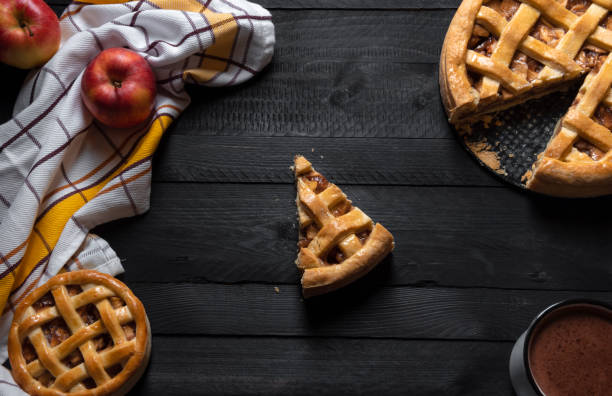 istock Apple pies and one slice in the middle. Top view. Sweet pastry 1069308132