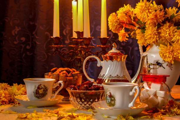 istock Retro style cups of tea with candle light 1069308436