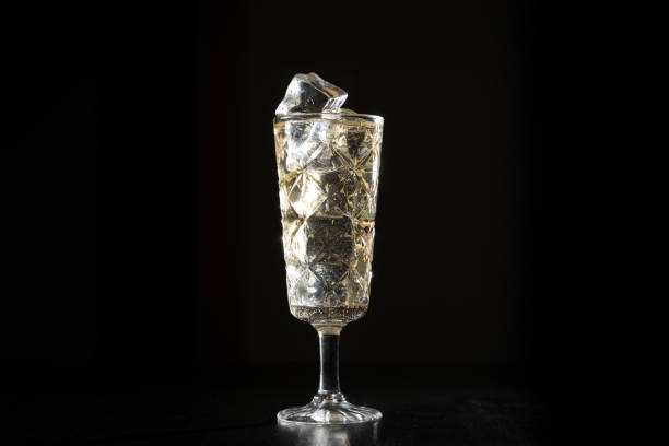 istock dark moody drink alcohol glass ice hand 1069310640