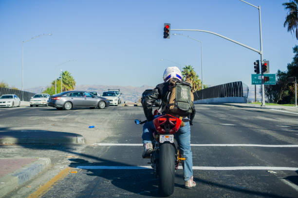 December 6, 2017 San Jose / CA / USA -  Motorcyclist waiting at a traffic light, south San Francisco bay area