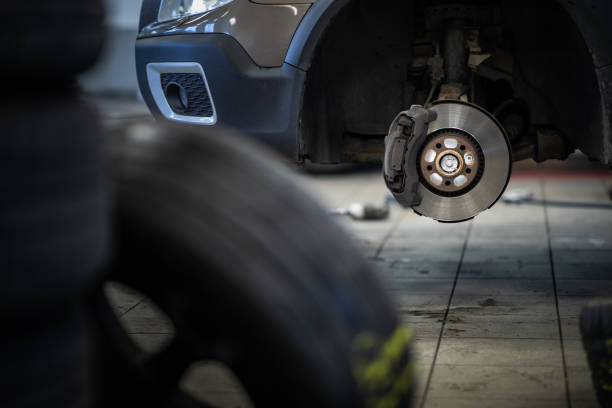 istock Mechanic changing a wheel of a modern car 1069312770