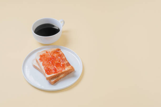 istock Toast with jam and a cup of coffee 1069312780