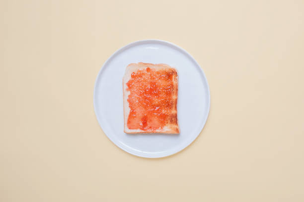 istock Slice of toast on a white plate 1069313120