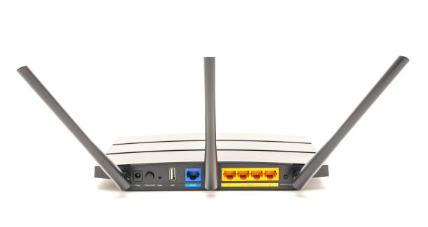 istock Back view of wireless router cable modem isolated on white background 1069314970
