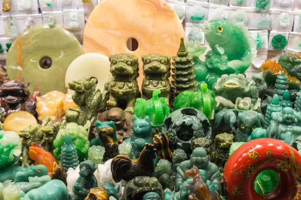 Photo of Close-up of Jade statues and souvenirs at the Jade Market, Hong Kong, Kowloon, Yau Ma Tei