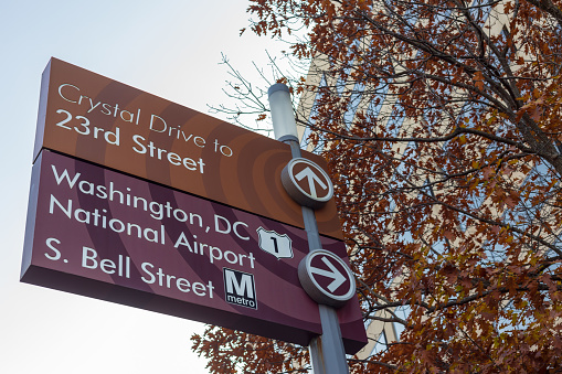 ARLINGTON, V.A. - NOVEMBER 17 2018: Signage along Crystal Drive in Crystal City points to the multitude of transit options nearby including light rail, metro train, and air.