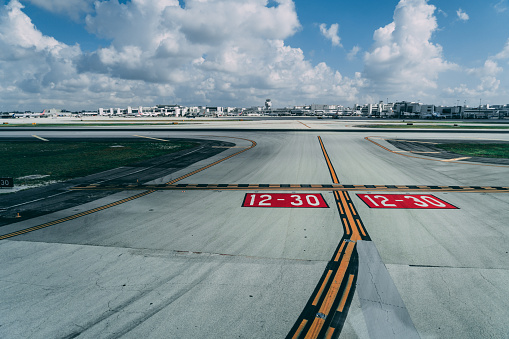 Miami International airport runway markings in taxiway. Seen from a commercial airplane cocckpit.