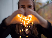 Young woman with magic lights