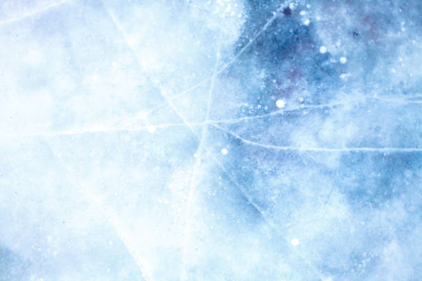 istock texture of a beautiful blue ice with cracks 1069358644